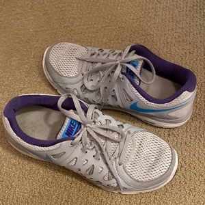 Nike tennis shoes, grey with blue check and purple accent. Size 8.5